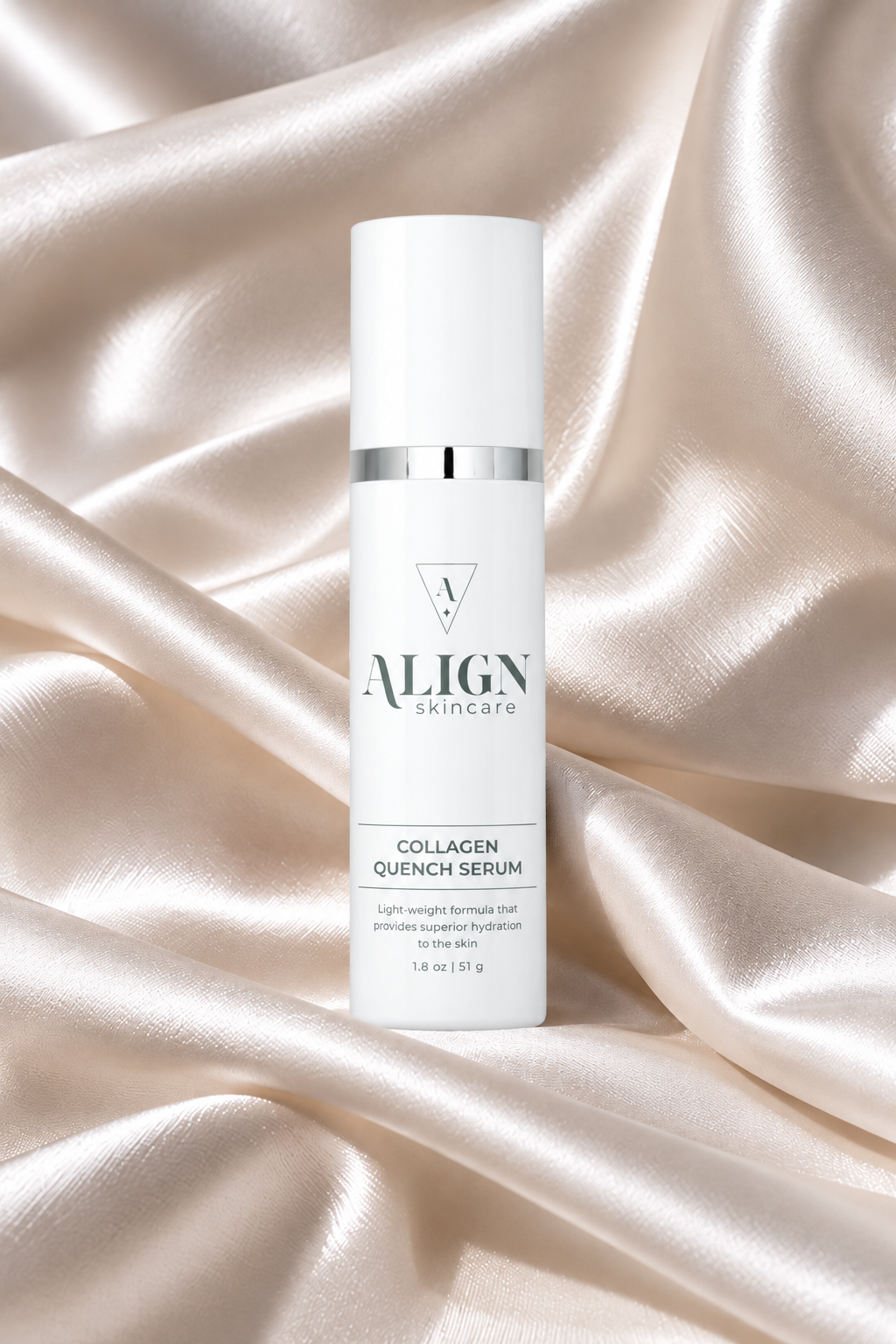 A white cylindrical skincare bottle labeled 'ALIGN skincare Collagen Quench Serum' standing upright on draped champagne satin fabric.