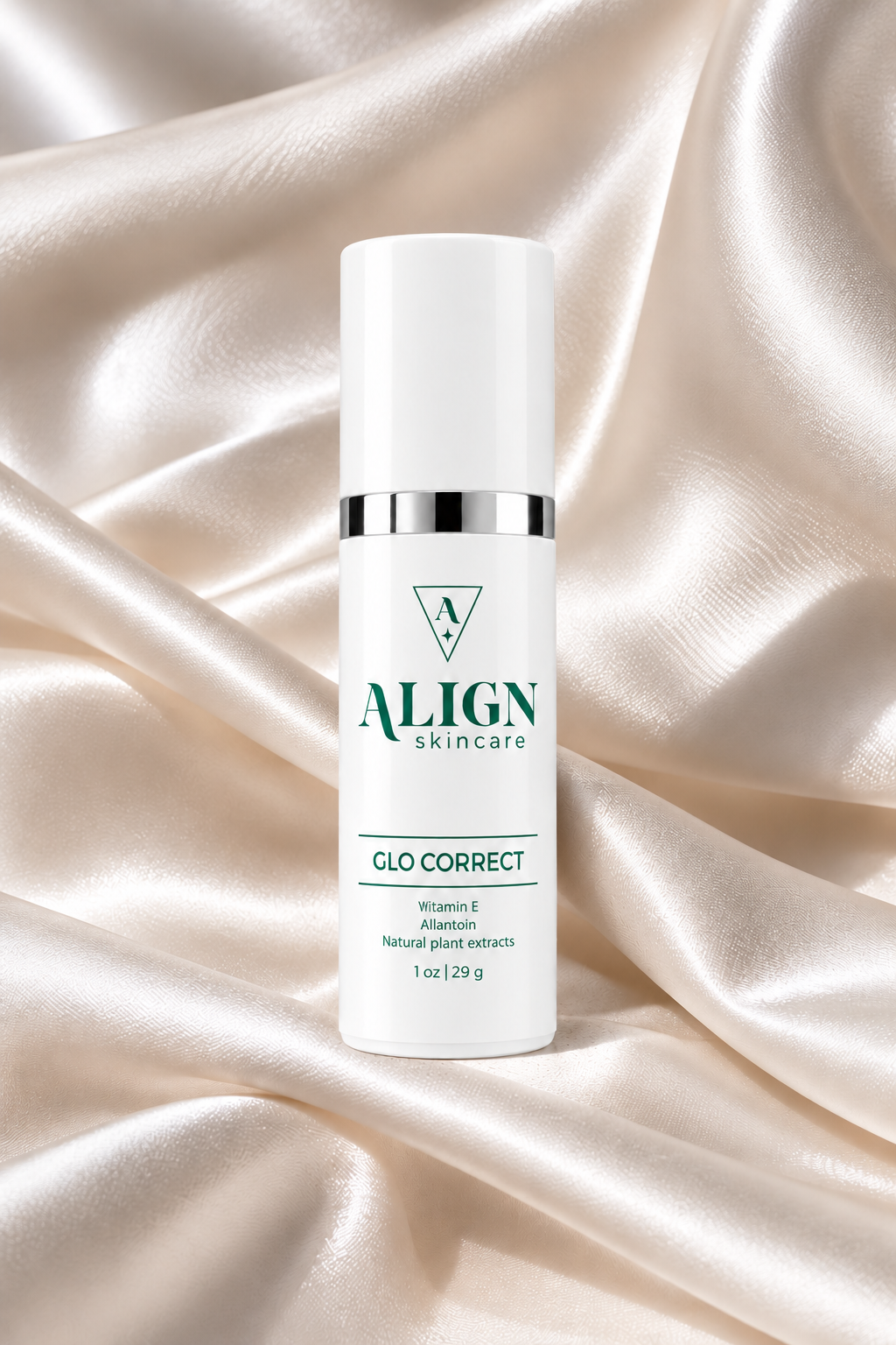 A white Align Skincare Glo Correct bottle with a silver band and green text, set against a draped champagne satin background.