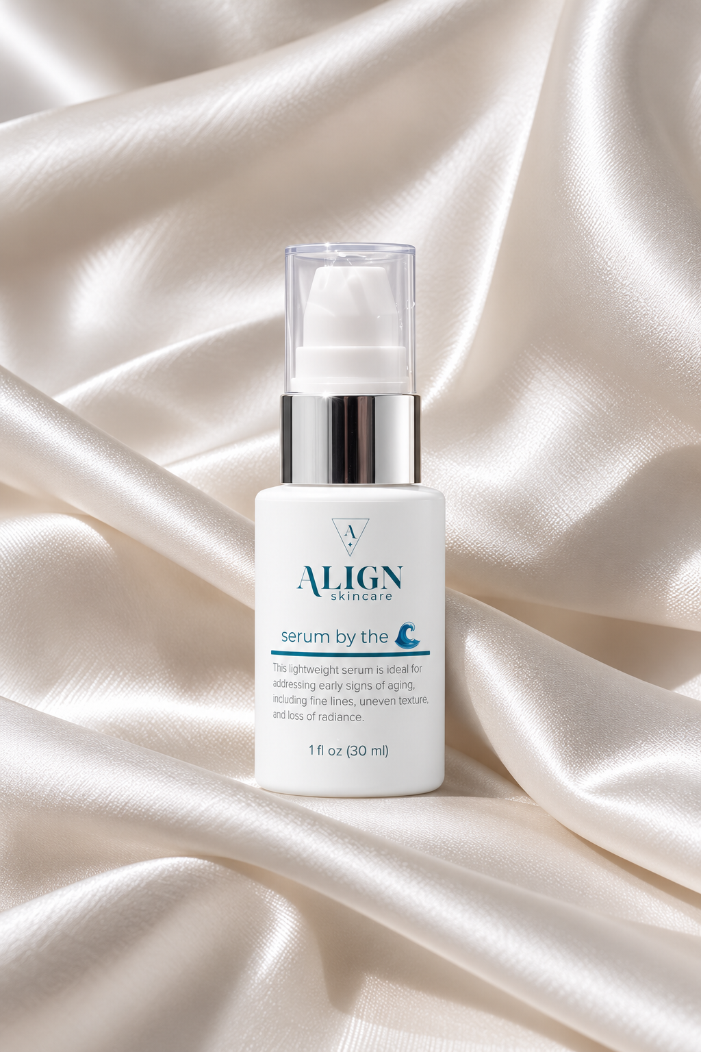 Align Skincare 'Serum by the Sea' 1 fl oz pump bottle, displayed on draped white satin fabric.