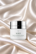 firming antioxidant anti-aging moisturizer in pump  on white satin background 