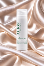 A white bottle of ALIGN Skincare 'charge me' serum centered on a draped champagne satin fabric background.