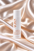 A white cylindrical bottle of ALIGN Skincare protect me eye cream, set against a luxurious draped satin fabric backdrop in warm champagne tones.